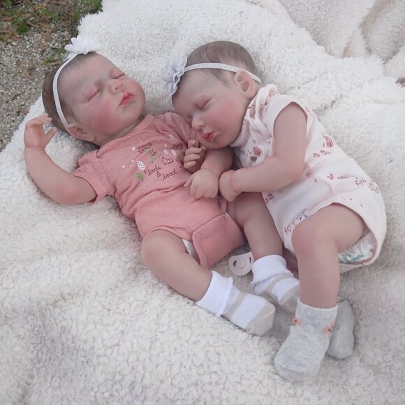 Realistic reborn twin dolls